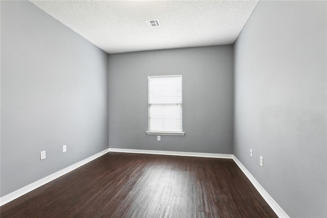 1902 Huey P Long Ave, Gretna, LA 70053 - empty room with wood finished floors, baseboards, and a textured ceiling