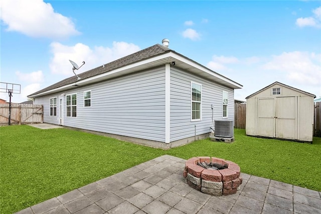 1902 Huey P Long Ave, Gretna, LA 70053 - back of property with a patio, a storage unit, an outbuilding, central AC, and a fire pit