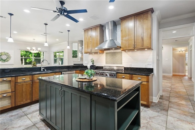 26 Camellia Dr, Covington, LA 70433 - kitchen featuring a sink, wall chimney range hood, brown cabinetry, a peninsula, and a center island