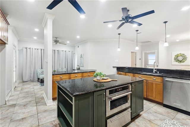 26 Camellia Dr, Covington, LA 70433 - kitchen featuring appliances with stainless steel finishes, a sink, a ceiling fan, ornamental molding, and a kitchen island