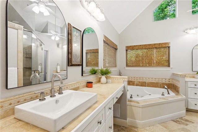 26 Camellia Dr, Covington, LA 70433 - bathroom with ceiling fan, vanity, a tub with jets, a shower stall, and high vaulted ceiling