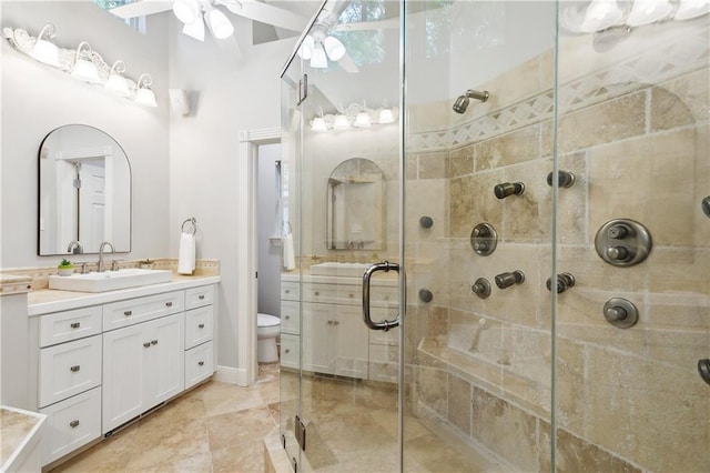 26 Camellia Dr, Covington, LA 70433 - full bathroom featuring a shower stall, toilet, a ceiling fan, and vanity