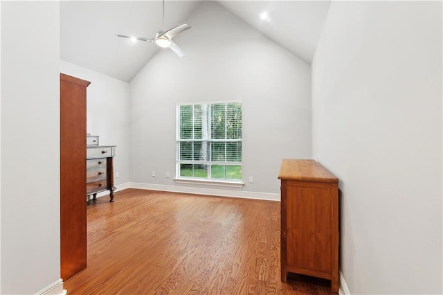 26 Camellia Dr, Covington, LA 70433 - unfurnished bedroom featuring high vaulted ceiling, wood finished floors, baseboards, and a ceiling fan