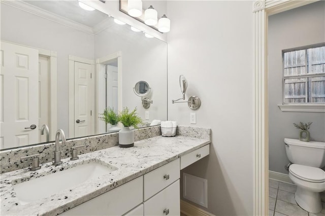 26 Camellia Dr, Covington, LA 70433 - bathroom featuring vanity, baseboards, crown molding, toilet, and tile patterned flooring