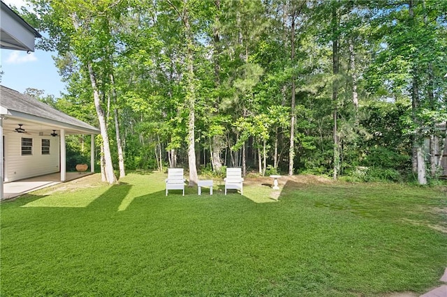 26 Camellia Dr, Covington, LA 70433 - view of grassy yard featuring a ceiling fan and a patio