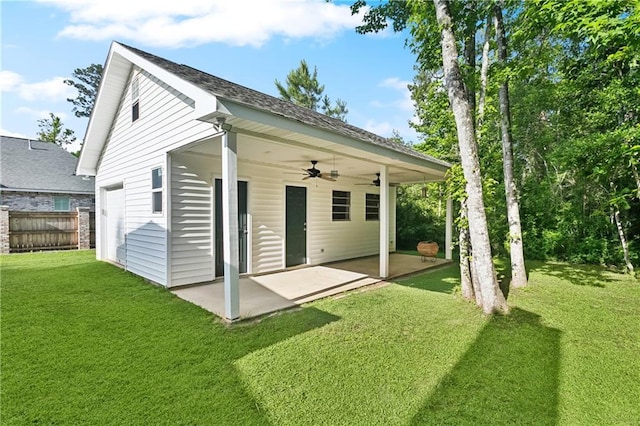 26 Camellia Dr, Covington, LA 70433 - back of property featuring a patio area, a ceiling fan, and a garage