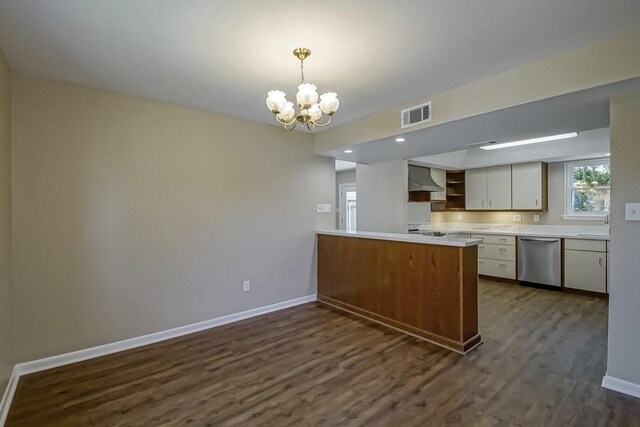 5831 Durbridge Dr, New Orleans, LA 70131 - kitchen featuring dishwasher, a chandelier, a peninsula, dark wood-style flooring, and baseboards