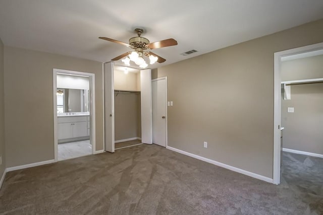 5831 Durbridge Dr, New Orleans, LA 70131 - unfurnished bedroom featuring carpet, connected bathroom, baseboards, a ceiling fan, and a closet