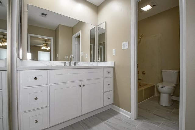 5831 Durbridge Dr, New Orleans, LA 70131 - bathroom featuring vanity, toilet, shower / washtub combination, a ceiling fan, and baseboards