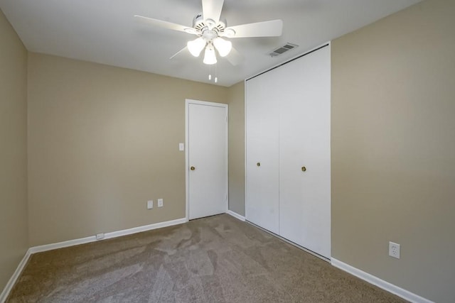 5831 Durbridge Dr, New Orleans, LA 70131 - unfurnished bedroom with carpet, baseboards, a closet, and a ceiling fan