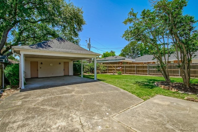 5831 Durbridge Dr, New Orleans, LA 70131 - garage featuring driveway and a carport