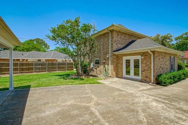5831 Durbridge Dr, New Orleans, LA 70131 - back of property with brick siding, a patio, and french doors