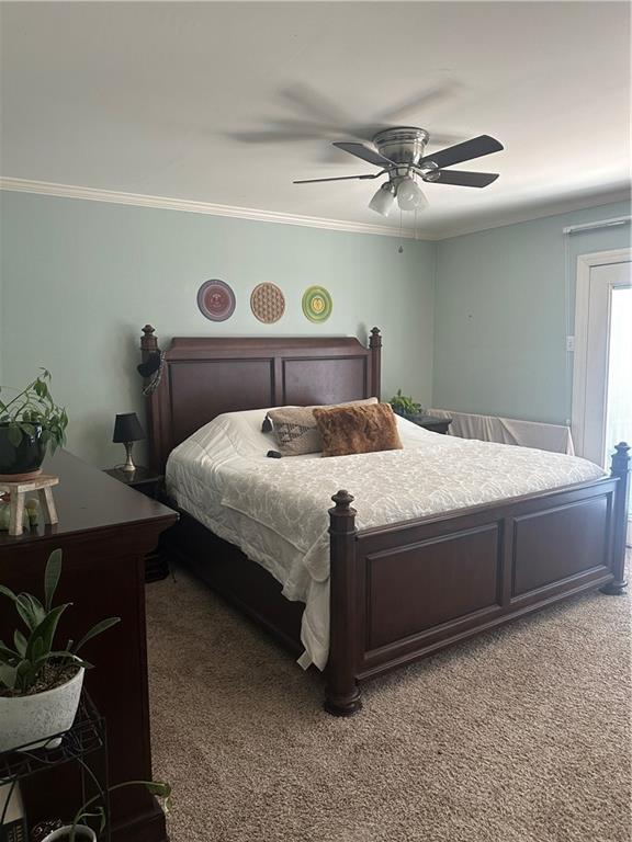 3725 Marion St Unit 5, Metairie, LA 70002 - carpeted bedroom with crown molding and a ceiling fan