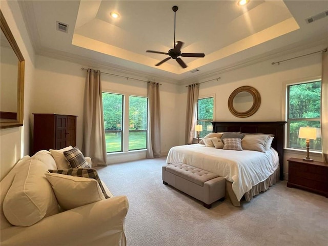 7 Spanish Moss Ct, Mandeville, LA 70471 - bedroom featuring light carpet, a raised ceiling, recessed lighting, crown molding, and a ceiling fan