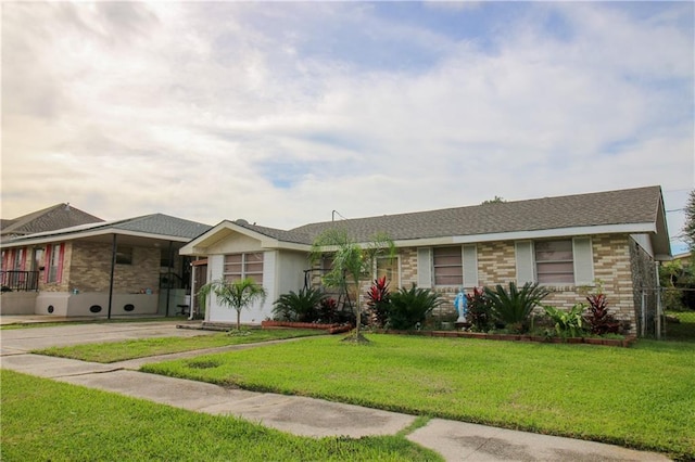 1620 Maplewood Dr, Harvey, LA 70058 - ranch-style home featuring brick siding, a front yard, and a shingled roof
