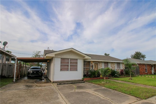 1620 Maplewood Dr, Harvey, LA 70058 - view of front facade featuring concrete driveway and a carport