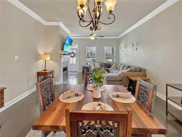 629 High Ridge Loop, Slidell, LA 70458 - dining area with a chandelier, crown molding, baseboards, a premium fireplace, and a ceiling fan