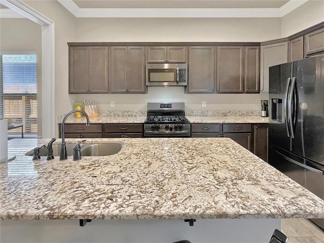 629 High Ridge Loop, Slidell, LA 70458 - kitchen with stainless steel appliances, a sink, light stone countertops, ornamental molding, and dark brown cabinets