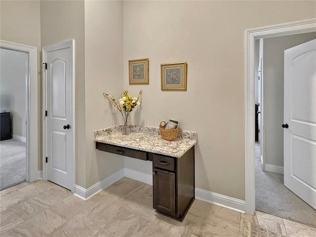 629 High Ridge Loop, Slidell, LA 70458 - hallway with baseboards, a desk, and light carpet