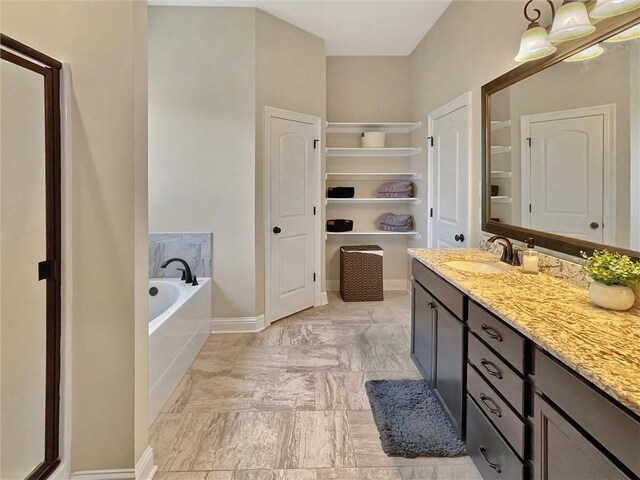 629 High Ridge Loop, Slidell, LA 70458 - full bath featuring a bath, vanity, a closet, and baseboards