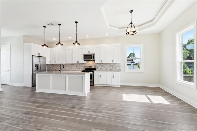5128 Cunningham Ct, New Orleans, LA 70126 - kitchen featuring appliances with stainless steel finishes, plenty of natural light, backsplash, a sink, and recessed lighting
