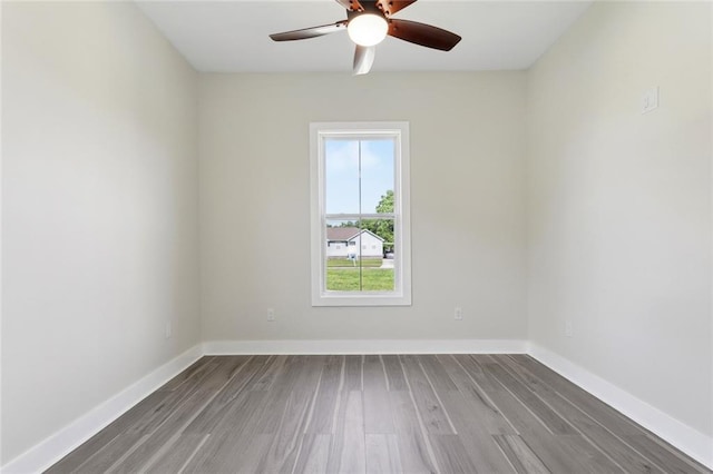5128 Cunningham Ct, New Orleans, LA 70126 - empty room with wood finished floors, a ceiling fan, and baseboards