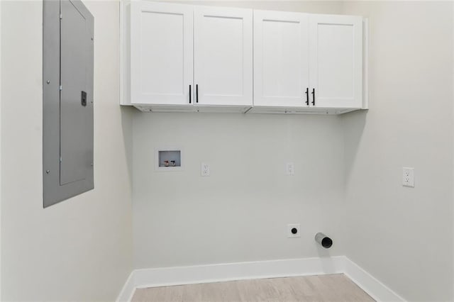 5128 Cunningham Ct, New Orleans, LA 70126 - clothes washing area with cabinet space, electric panel, washer hookup, and baseboards
