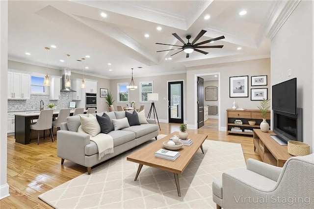 3821 Indiana St, New Orleans, LA 70114 - living room with recessed lighting, ornamental molding, light wood-style floors, plenty of natural light, and baseboards