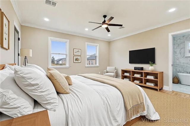 3821 Indiana St, New Orleans, LA 70114 - bedroom featuring wood finished floors, recessed lighting, crown molding, ensuite bath, and baseboards