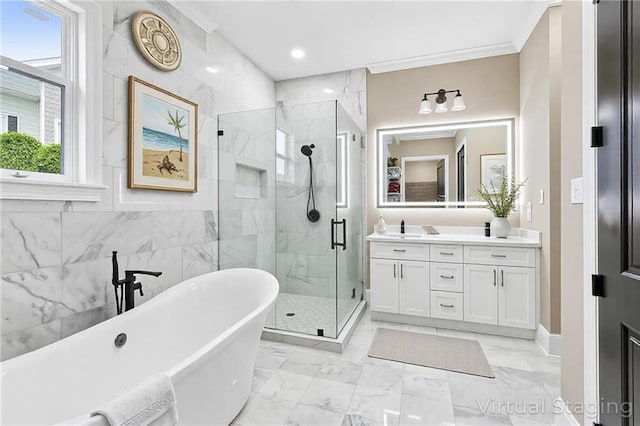 3821 Indiana St, New Orleans, LA 70114 - bathroom featuring a shower stall, a freestanding tub, vanity, marble look tiles, and ornamental molding