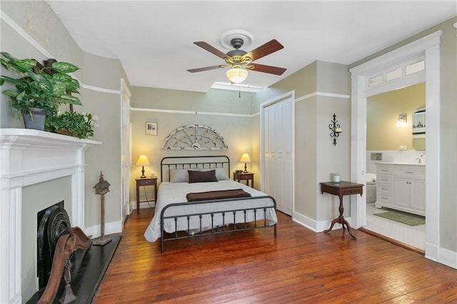 627 Ursulines Ave Unit 9, New Orleans, LA 70116 - bedroom with hardwood / wood-style floors, a fireplace, baseboards, and a closet