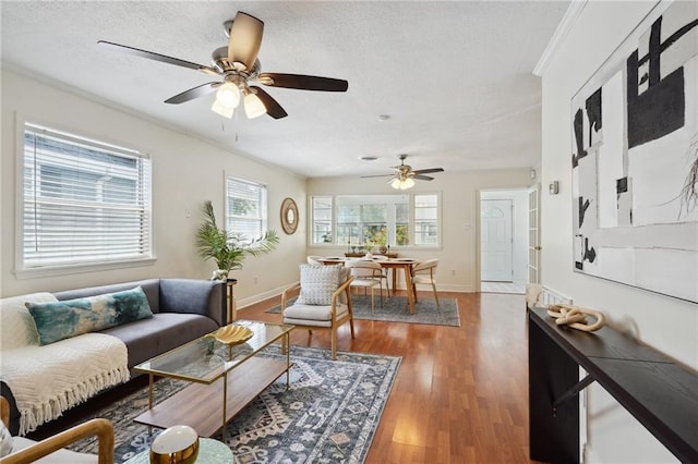 4 Virginia Ct, New Orleans, LA 70124 - living area featuring ceiling fan, baseboards, wood finished floors, and a textured ceiling