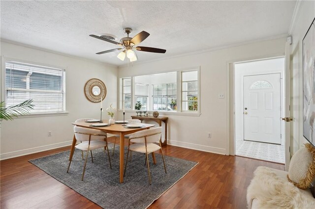 4 Virginia Ct, New Orleans, LA 70124 - dining area featuring wood finished floors, baseboards, crown molding, ceiling fan, and a textured ceiling