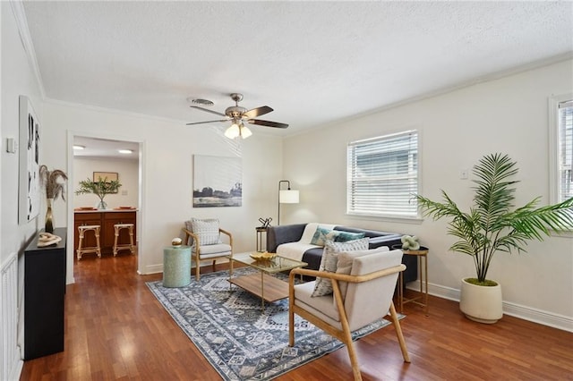 4 Virginia Ct, New Orleans, LA 70124 - living area featuring crown molding, wood finished floors, a ceiling fan, a textured ceiling, and baseboards