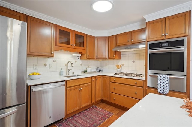 4 Virginia Ct, New Orleans, LA 70124 - kitchen featuring appliances with stainless steel finishes, a sink, light countertops, under cabinet range hood, and a warming drawer