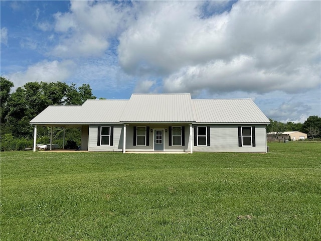 24473 Timbercrest Dr, Franklinton, LA 70438 - view of front of home with metal roof, a front lawn, and a porch