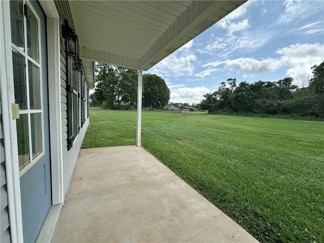 24473 Timbercrest Dr, Franklinton, LA 70438 - view of grassy yard with a patio area