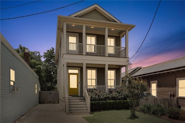 1723 N Broad St, New Orleans, LA 70119 - view of front facade with a porch, a balcony, and fence