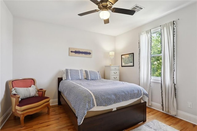 1723 N Broad St, New Orleans, LA 70119 - bedroom featuring wood finished floors, baseboards, and ceiling fan