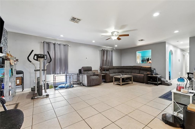 2713 Legend St, Meraux, LA 70075 - living area with light tile patterned floors, a ceiling fan, recessed lighting, and arched walkways