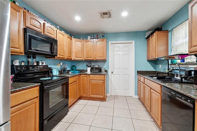 2713 Legend St, Meraux, LA 70075 - kitchen with black appliances, a sink, light tile patterned floors, recessed lighting, and dark stone countertops