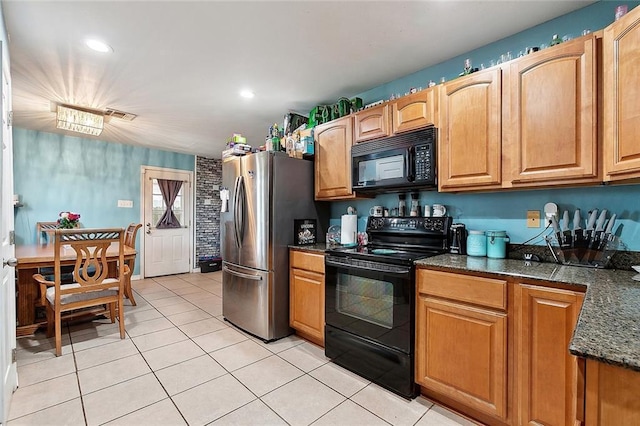 2713 Legend St, Meraux, LA 70075 - kitchen with black appliances, light tile patterned flooring, dark stone counters, and recessed lighting