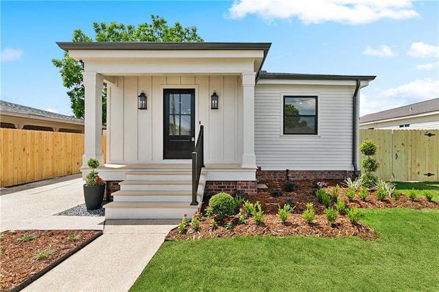 4412 Camel St, Metairie, LA 70001 - view of front facade with board and batten siding and covered porch