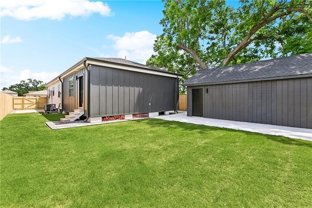 4412 Camel St, Metairie, LA 70001 - back of property with entry steps, board and batten siding, a gate, central AC unit, and an outdoor structure