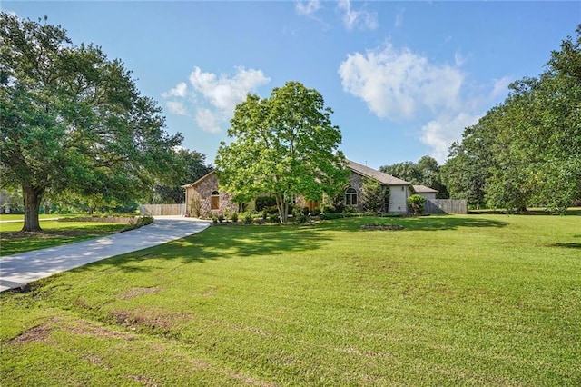 25506 Cardinal Ct, Bush, LA 70431 - obstructed view of property with concrete driveway and stone siding