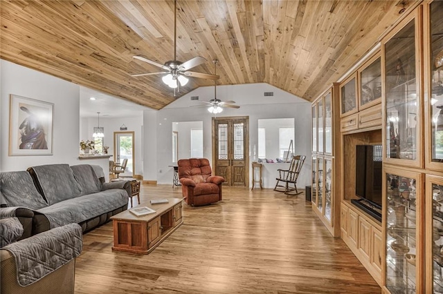 25506 Cardinal Ct, Bush, LA 70431 - living room with wood ceiling, light wood finished floors, vaulted ceiling, and ceiling fan