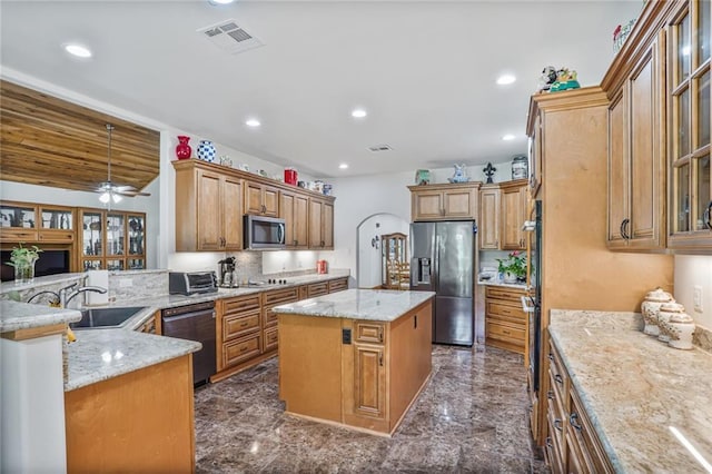 25506 Cardinal Ct, Bush, LA 70431 - kitchen with appliances with stainless steel finishes, a sink, dark marble finish floors, light stone counters, and recessed lighting