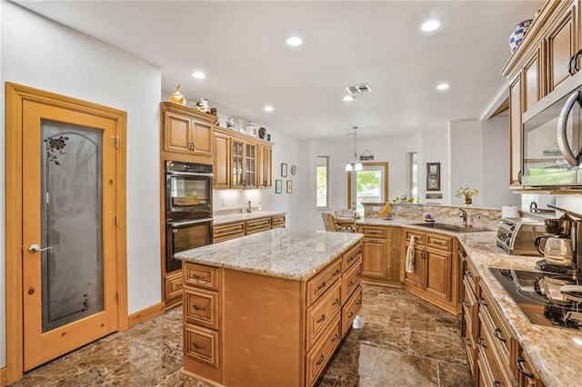 25506 Cardinal Ct, Bush, LA 70431 - kitchen with black appliances, a sink, a peninsula, recessed lighting, and light stone countertops