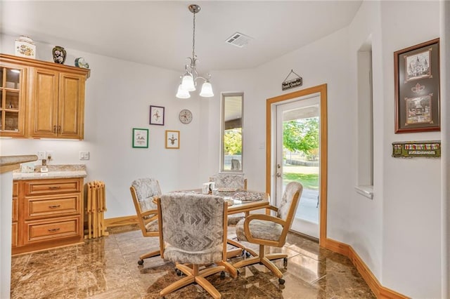 25506 Cardinal Ct, Bush, LA 70431 - dining room featuring baseboards and a chandelier