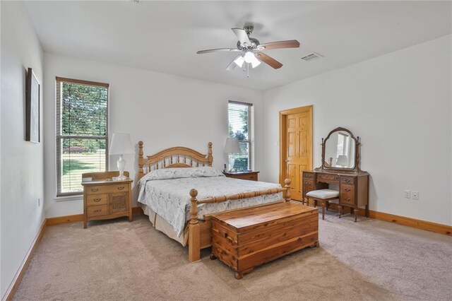 25506 Cardinal Ct, Bush, LA 70431 - bedroom with light colored carpet, baseboards, and a ceiling fan